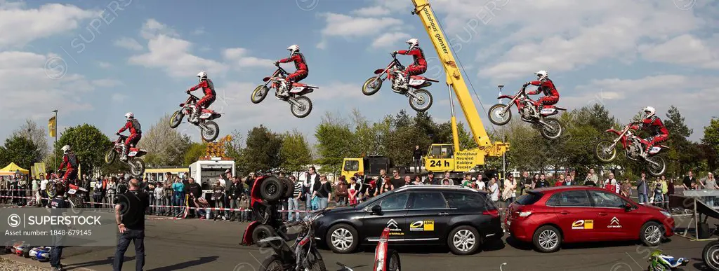 Motorcycle stuntman Mike Auffenberg jumping over cars with his cross machine, Koblenz, Rhineland-Palatinate, Germany, Europe