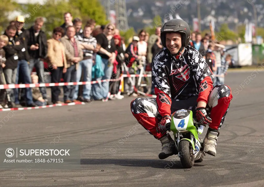 Motorcycle stuntman Mike Auffenberg riding a pocket bike, Koblenz, Rhineland-Palatinate, Germany, Europe