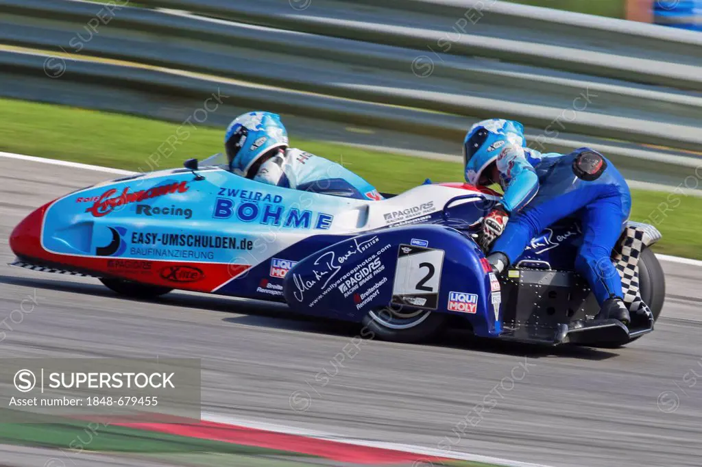 Motorcycle racers Mike Roscher and Danny Kamerbeek, Germany, compete in the Sidecar cup on August 21, 2011 in Zeltweg, Austria, Europe