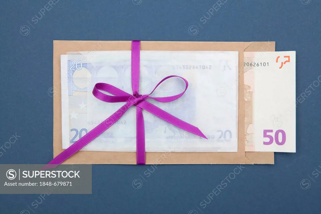 Envelope with banknotes and a ribbon, gift of money, bribery