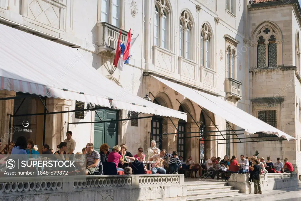 Tourists sitting in Gradska Kavana Café, Dubrovnik, Dalmatia, Croatia, Europe