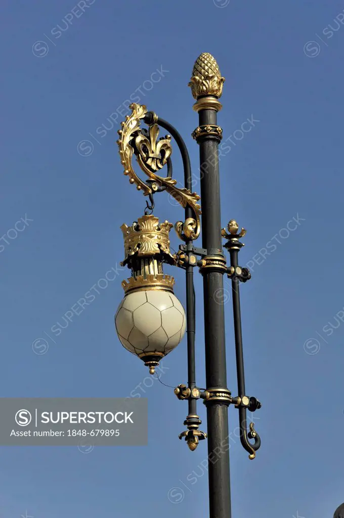 Gold-plated lamp post on the grounds of the Palacio Real or Royal Palace, Madrid, Spain, Europe