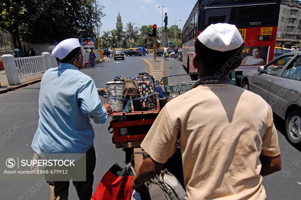 Dabba wallahs or food deliverers pushing a cart with Dabbas or food containers for delivery, Nariman Point, Mumbai, India, Asia