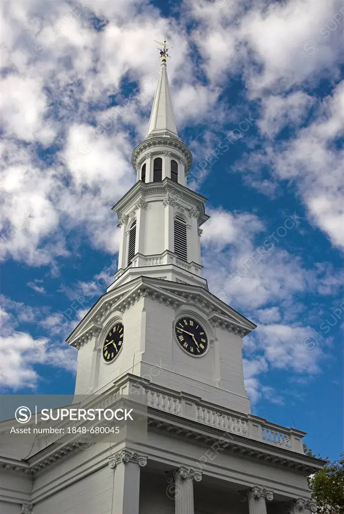 The white-steepled First Parish Church against a white and blue sky, Lexington, Massachusetts, USA