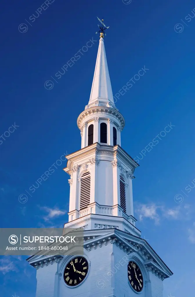 The white-steepled First Parish Church against a white and blue sky, Lexington, Massachusetts, USA