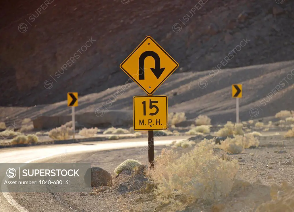 Sharp curve traffic sign, curvy road, Artist's Drive, Death Valley National Park, Mojave Desert, California, United States of America, USA
