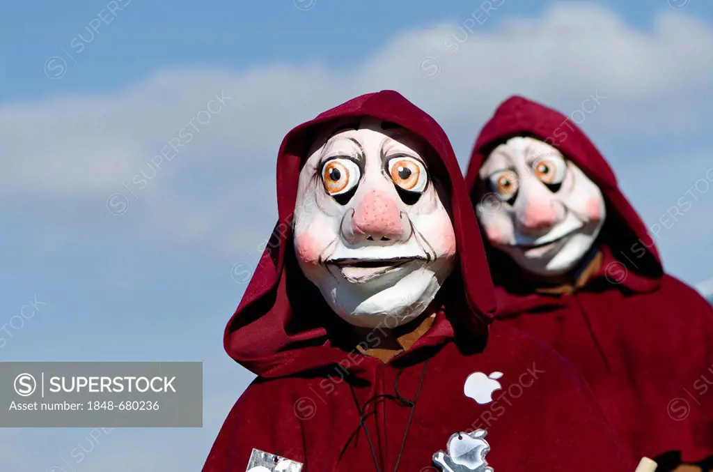 Masked people walking through the streets of Basel at Basler Fasnet carnival, Basel, Switzerland, Europe
