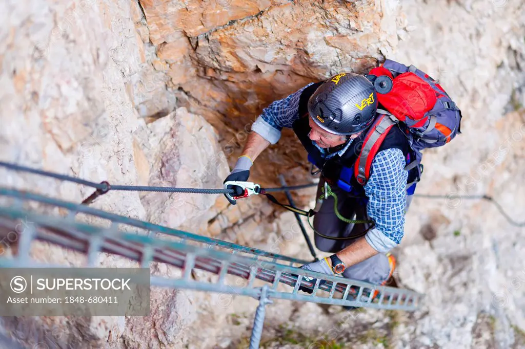 Climber on the Stevia fixed rope route in the Vallunga valley, Val Gardena, Dolomites, South Tyrol, Italy, Europe