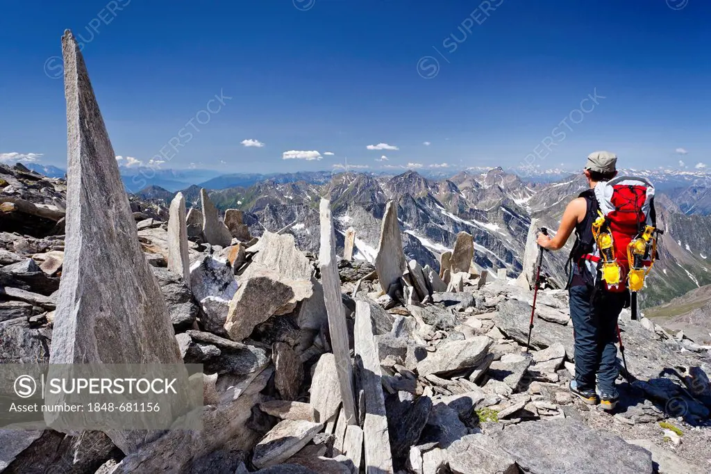 Climber descending from Mt. Hochfeiler, Pfitschtal valley, in the back the Pfitschtal and Wipptal valleys, South Tyrol, Italy, Europe