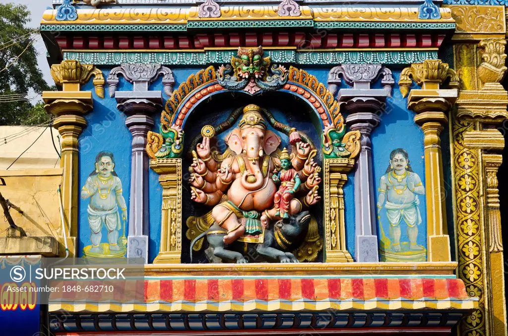 One of the Gopurams of the Menakshi-Sundareshwara Temple, up to 50 m high and artfully decorated with thousands of colourful statues of gods and deiti...