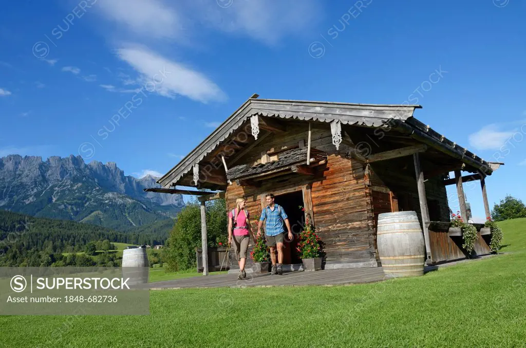 Hikers in front of Golfhuette mountain cabin, Ellmau, Wilder Kaiser mountain, Tyrol, Austria, Europe