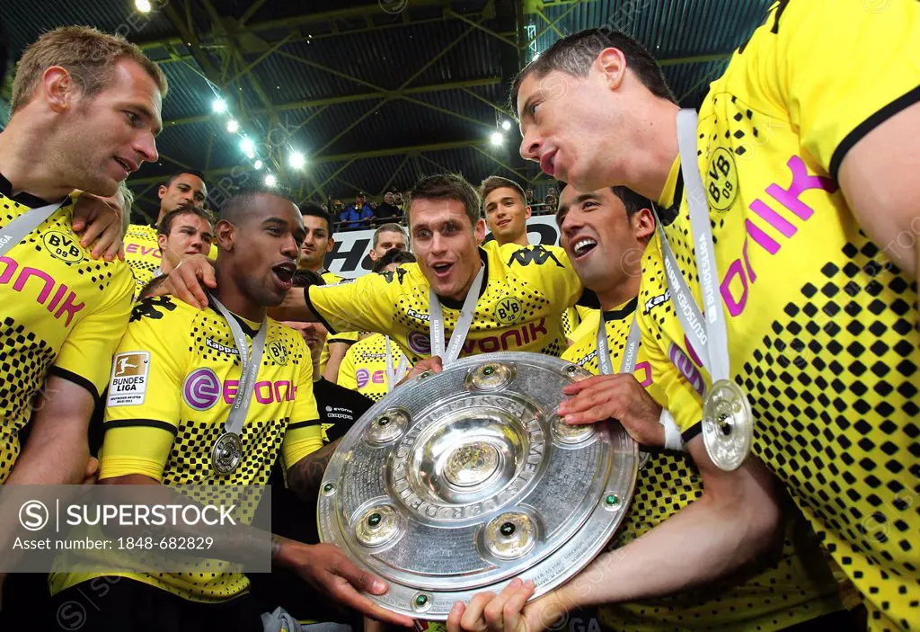 BVB Borussia Dortmund players with the league cup trophy, from left, Florian Kringe, Felipe Santana, Sebastian Kehl, Lucas Barrios, Robert Lewandowski...