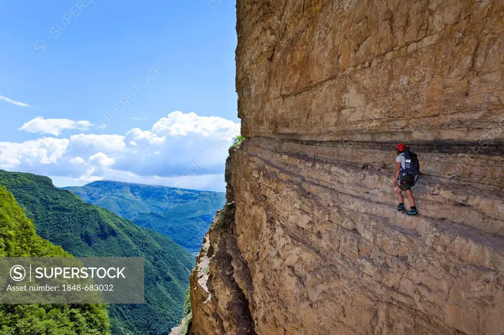 Mountain climber climbing the Gerardo Sega climbing route on Monte Baldo above Avio, Lake Garda region, Trentino, Italy, Europe