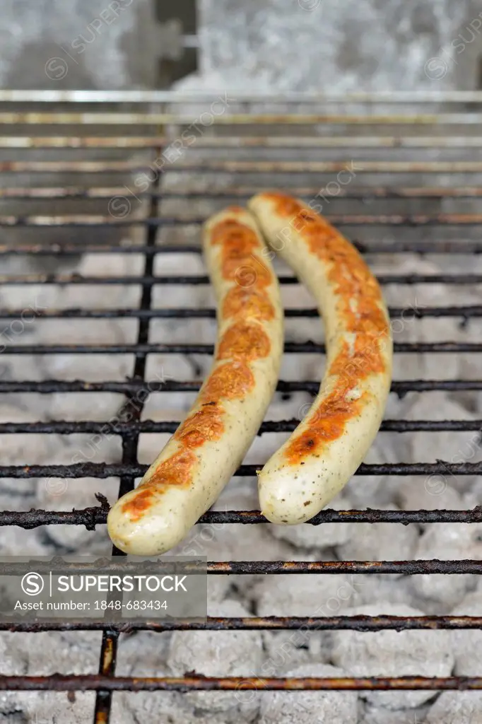 Bratwursts, sausages on a charcoal grill