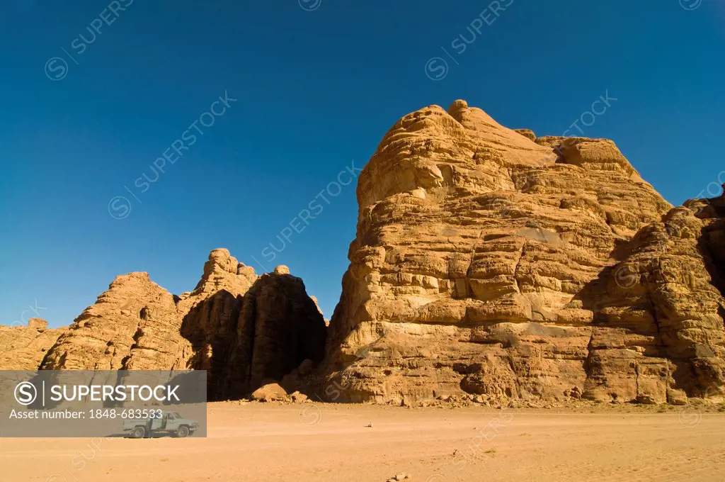 Rocks, an off-road vehicle in front, desert, Wadi Rum, Jordan, Middle East
