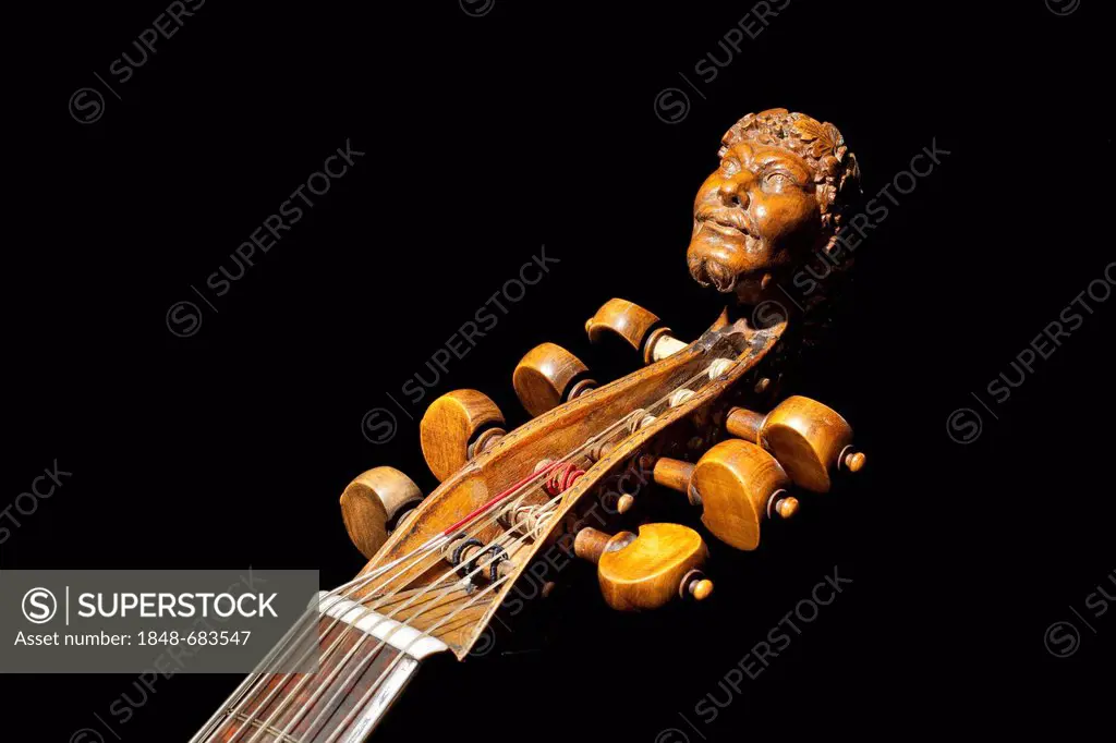 Carved head of Bacchus on a seven-string tenor bass viol from the 17th century, Haus Kemnade moated castle, Hattingen, North Rhine-Westphalia, Germany...