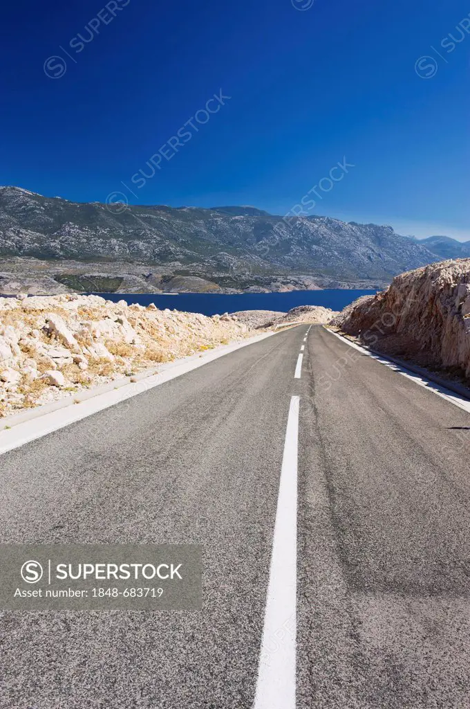 Road through karst landscape in Zigljen, Pag island, Dalmatia, Croatia, Europe