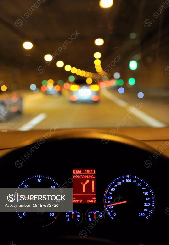 Night, poor visibility in a tunnel, tachometer with navigation display, VW Golf, illuminated, while driving