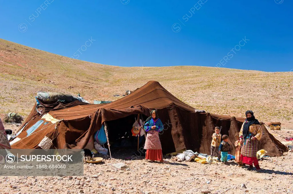 Women and children standing in front of their nomadic tent, Anti-Atlas Mountains, southern Morocco, Morocco, Africa