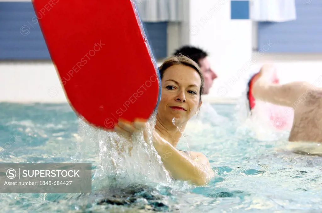 Patients doing aqua aerobics, water aerobics, exercise therapy, physiotherapy in water, e.g. as a rehabilitation program, in a hospital in Germany, Eu...