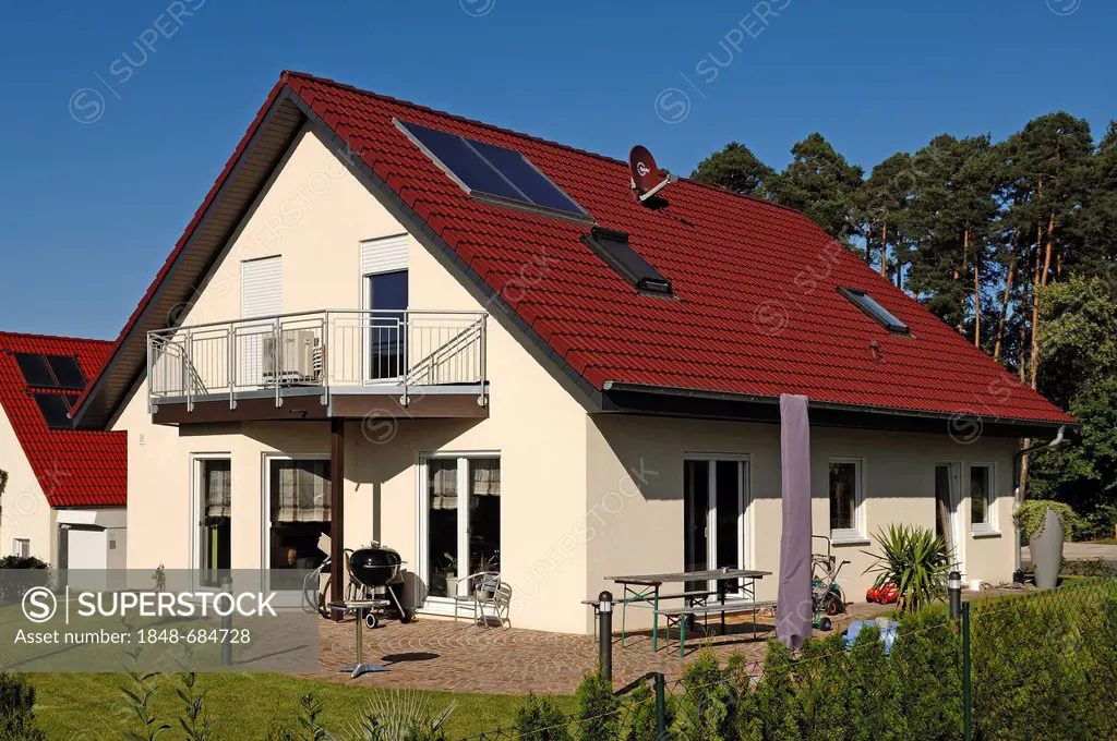 Recently completed house and garden with solar panels on the roof, Tauchersreuth, Middle Franconia, Bavaria, Germany, Europe