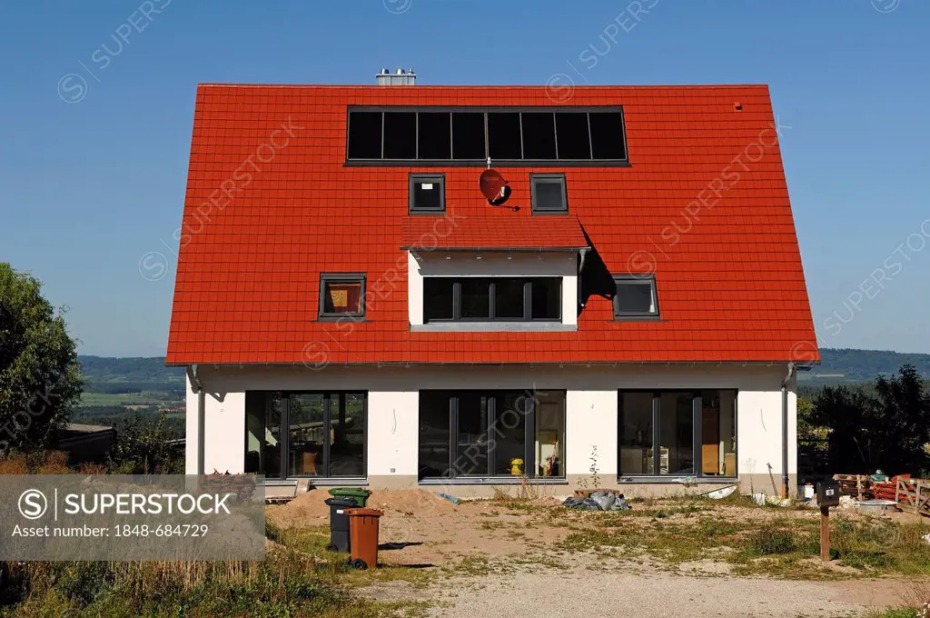 Recently completed house with solar panels on the roof, garden area is not yet complete, Tauchersreuth, Middle Franconia, Bavaria, Germany, Europe
