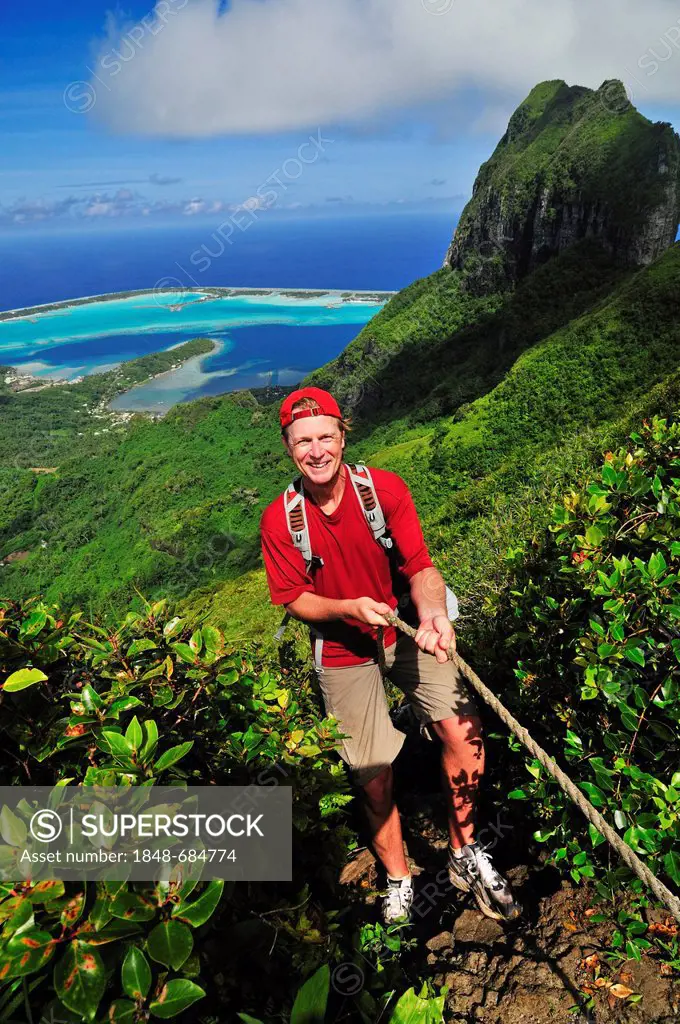 Woman hiking on Mt Pahia, Bora Bora, Leeward Islands, Society Islands, French Polynesia, Pacific Ocean