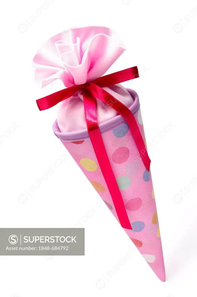 Pink schultuete or school cone filled with gifts and sweets