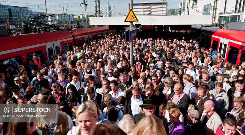 Many people on their way to the Wiesn or Oktoberfest grounds, S-Bahnhof Hackerbruecke station, Munich, Bavaria, Germany, Europe