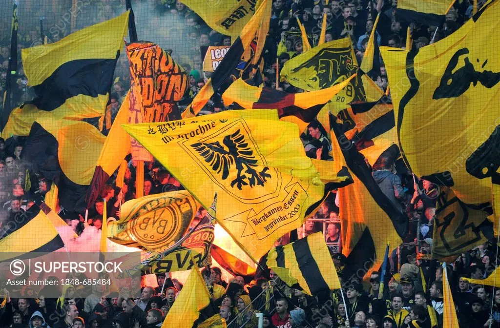 Fans of the football club BVB Borussia Dortmund on the south stand with flags and bengal flares during match Borussia Dortmund vs SC Freiburg (4:0), S...
