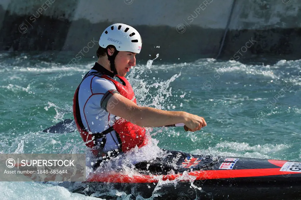 A canoeist at the 2012 Olympic White Water Centre on opening day, Lee Valley White Water Centre, Hertfordshire, England, United Kingdom, Europe