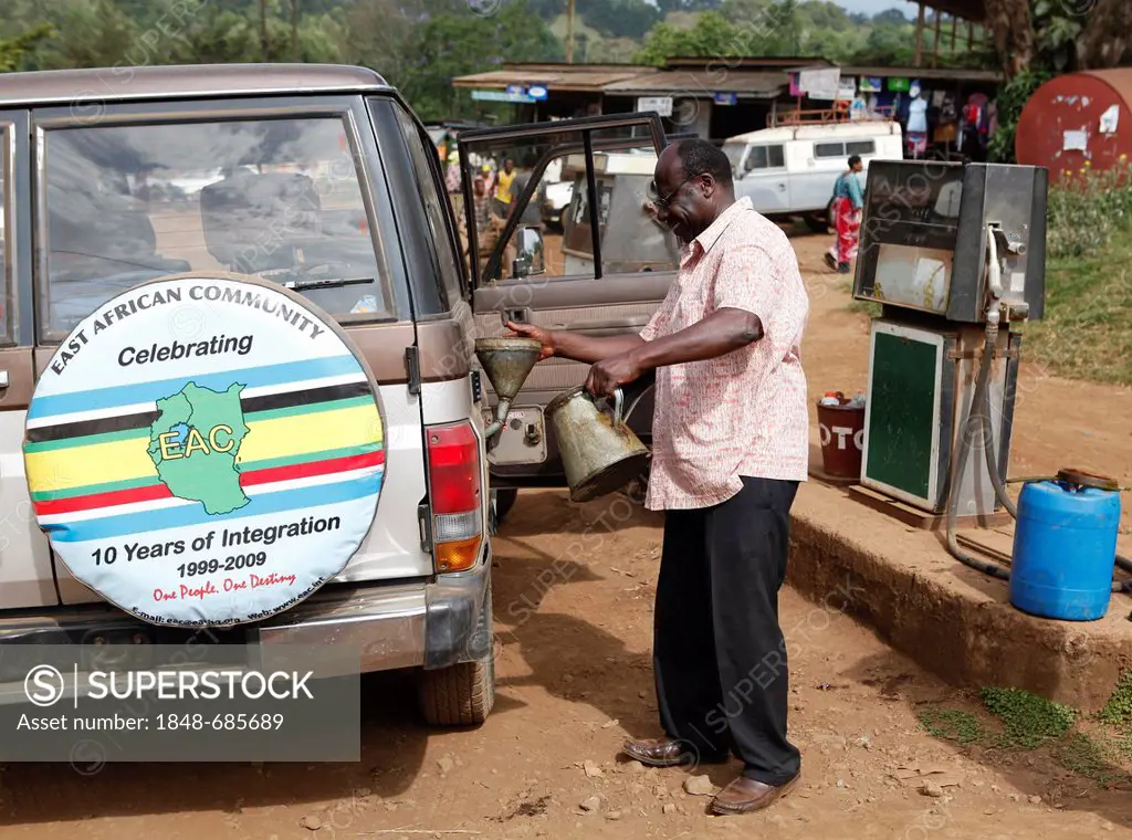 Gas station attendant at a gas station in Marangu village, Kilimanjaro National Park, Tanzania, East Africa, Africa