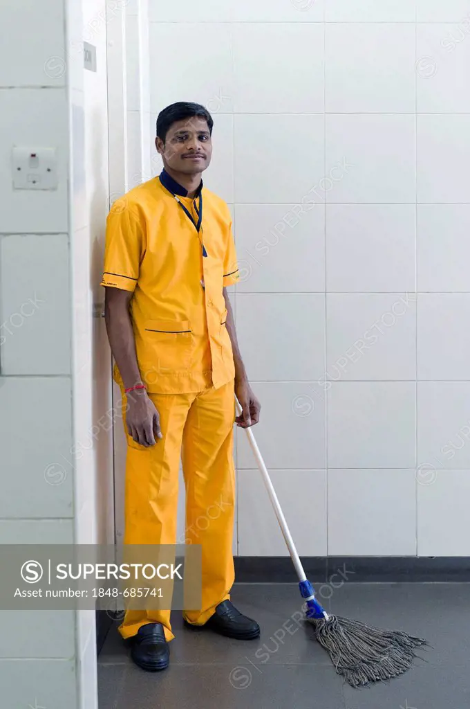 Man cleaning a toilet, Hyderabad Airport, Andhra Pradesh, southern India, India, Asia