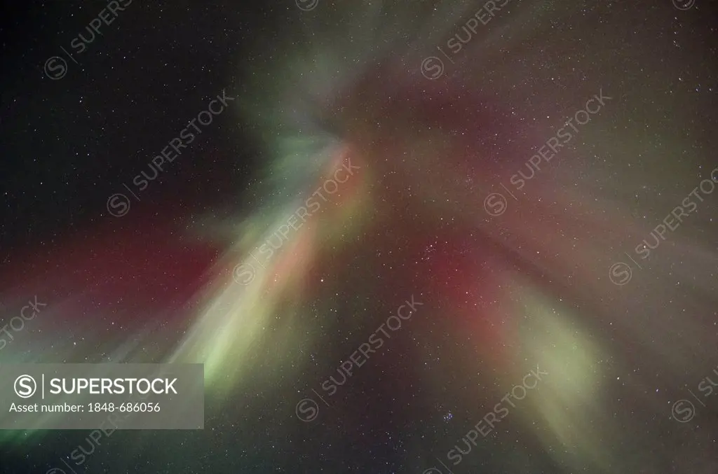 Green and red polar lights, aurora borealis, at the zenith forming a so-called corona, Longyearbyen, Spitsbergen, Svalbard, Norway, Europe