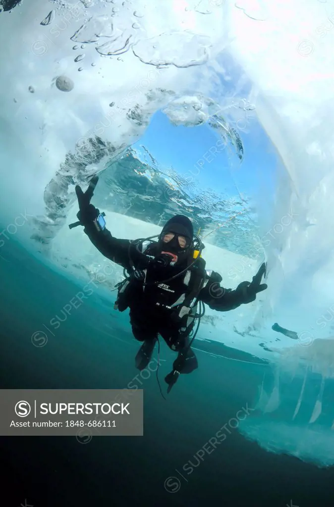Diver, ice-diving, Lake Baikal, Olkhon island, Siberia, Russia, Eurasia