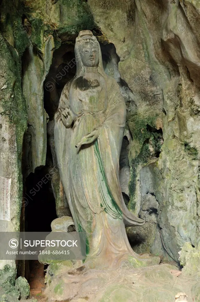 Hoa Nghiem cave with statue of Quan Am, holding a fap lam bottle with wonder-working water in the left hand, Marble Mountains or Ngu Hanh Son, Thuy So...