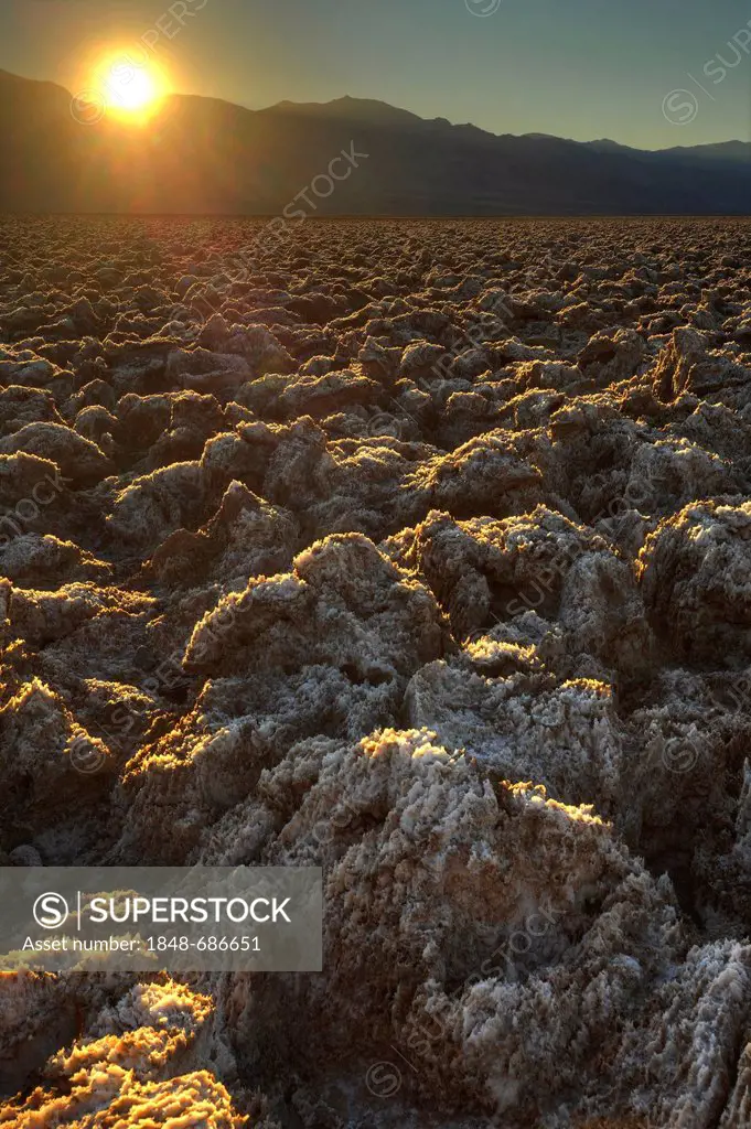 Salt crusts on the Devil's Golf Course, sunset, dusk, Panamint Range, Black Mountains, Death Valley National Park, Mojave Desert, California, USA