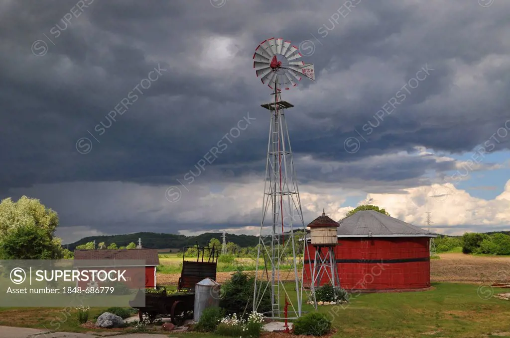 Storm brewing above a farm, Wisconsin, USA