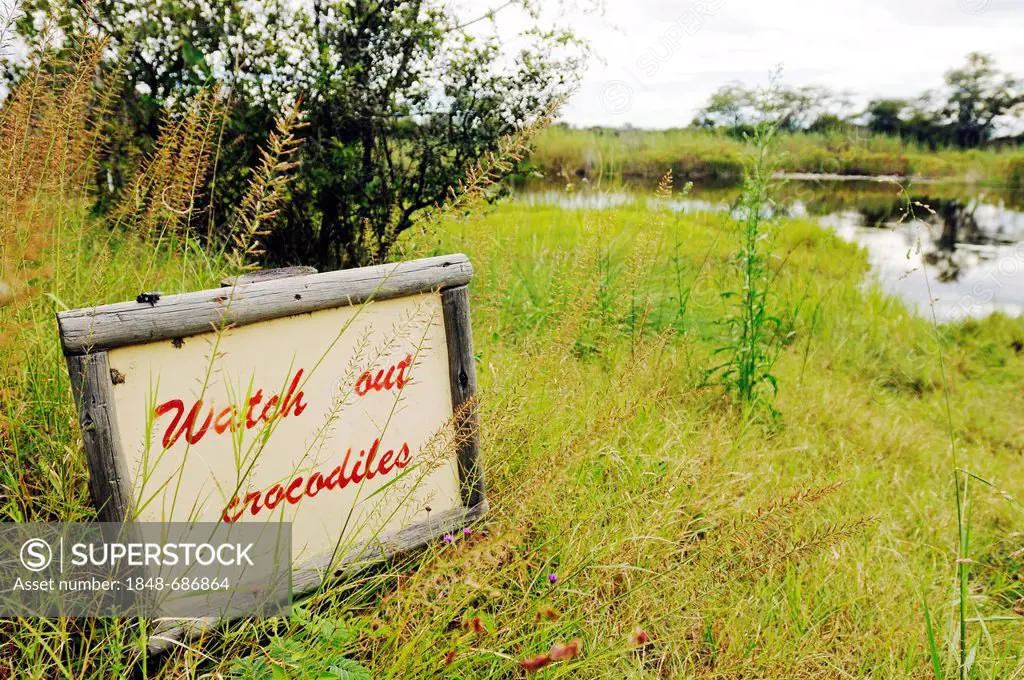 Sign Watch out, crocodiles, Camp Kwando, lodge and campground on the Kwando River, Caprivi Strip or Okavango Strip, Namibia, Africa