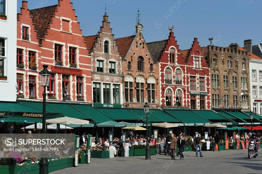 Restaurant terraces on the market square of Bruges, Flanders, Belgium, Europe