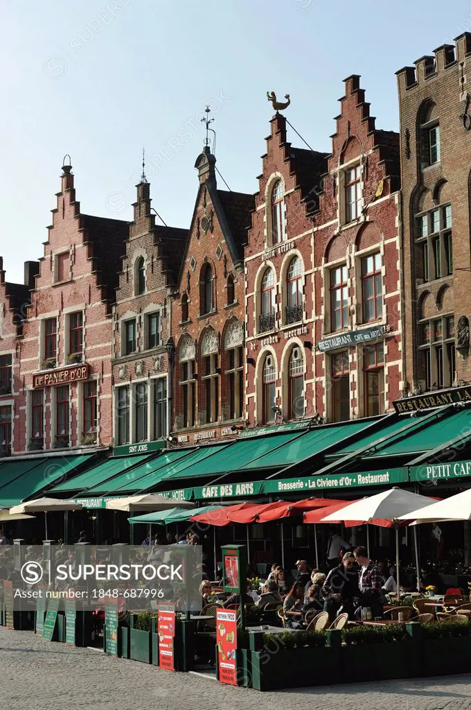 Restaurant terraces on the market square of Bruges, Flanders, Belgium, Europe