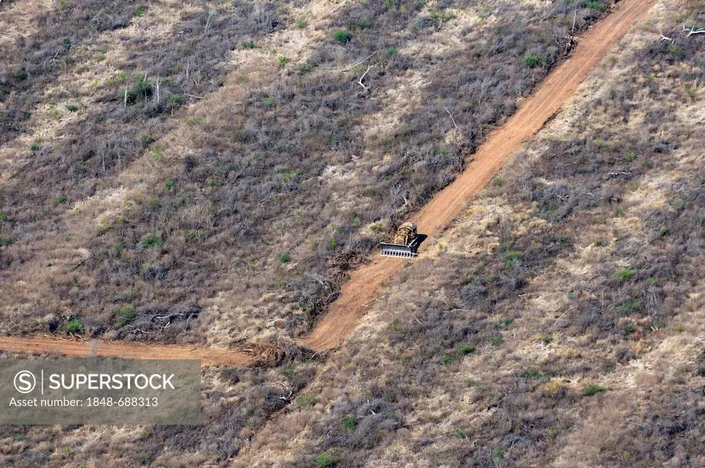 Aerial view from a Cessna aircraft, destroying a forest with bulldozers, the biomass is distributed over the cleared land and then burned, Gran Chaco,...