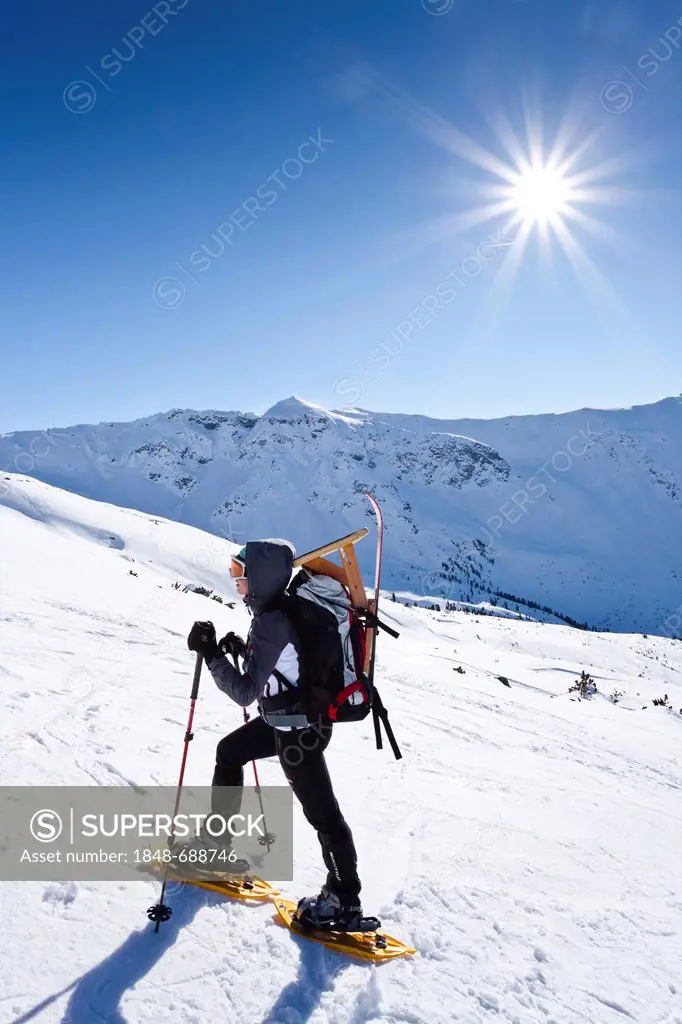 Snowshoe walker climbing Pfattenspitz mountain above Durnholz, Sarntal valley, province of Bolzano-Bozen, Italy, Europe