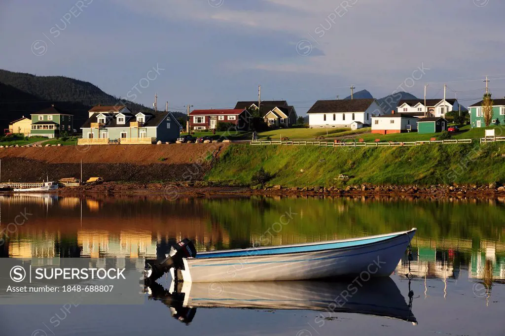 Houses and boats reflected in the sea, Norris Point, Newfoundland, Canada