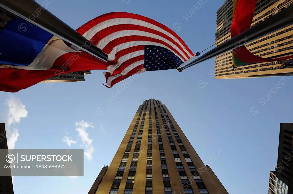 View of Rockefeller Center, Rockefeller Plaza, with an American national flag, Manhattan, New York, USA