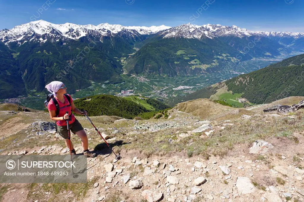 Hiker ascending to the Vermoispitze peak above Latsch, Vinschgau, behind the Martell valley, Ortler area, Mt. Zufallspitze and Mt. Cevedale, South Tyr...