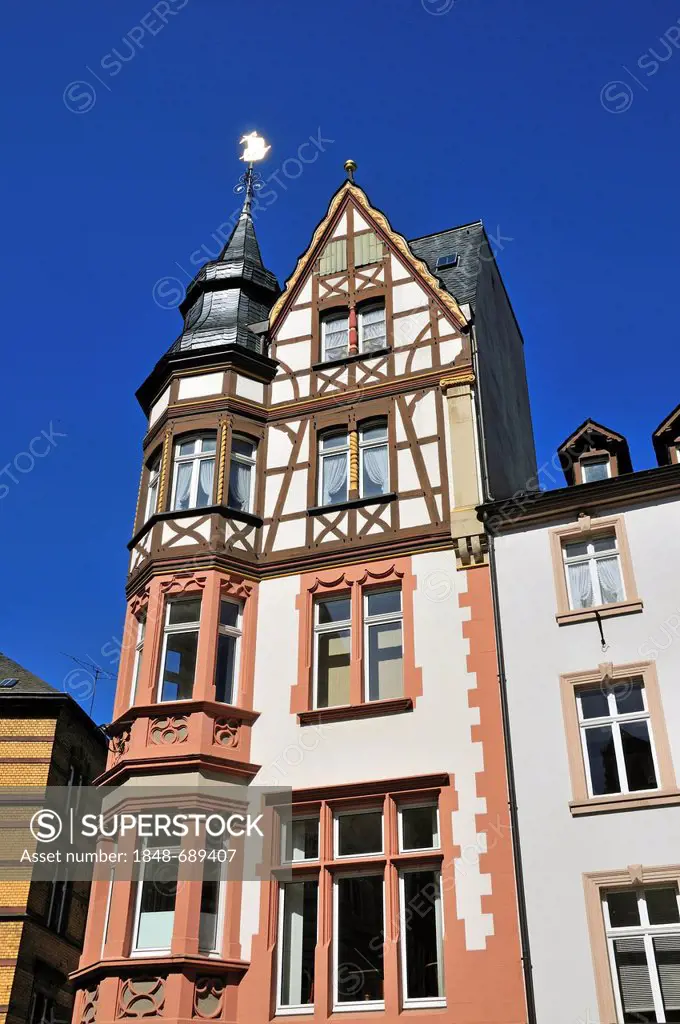 Half-timbered house with weathervane on the marketplace in Bernkastel-Kues, Rhineland-Palatinate, Germany, Europe