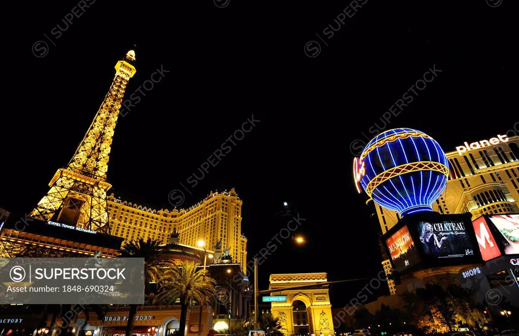 Night view, luxury hotel and Casino Paris with a simulated Eiffel Tower, Planet Hollywood, The Strip, Las Vegas, Nevada, United States of America, USA...