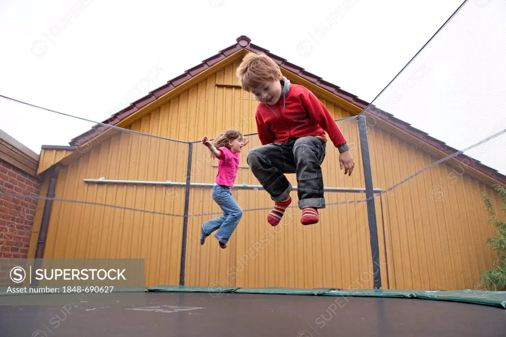 Children bouncing on a trampoline