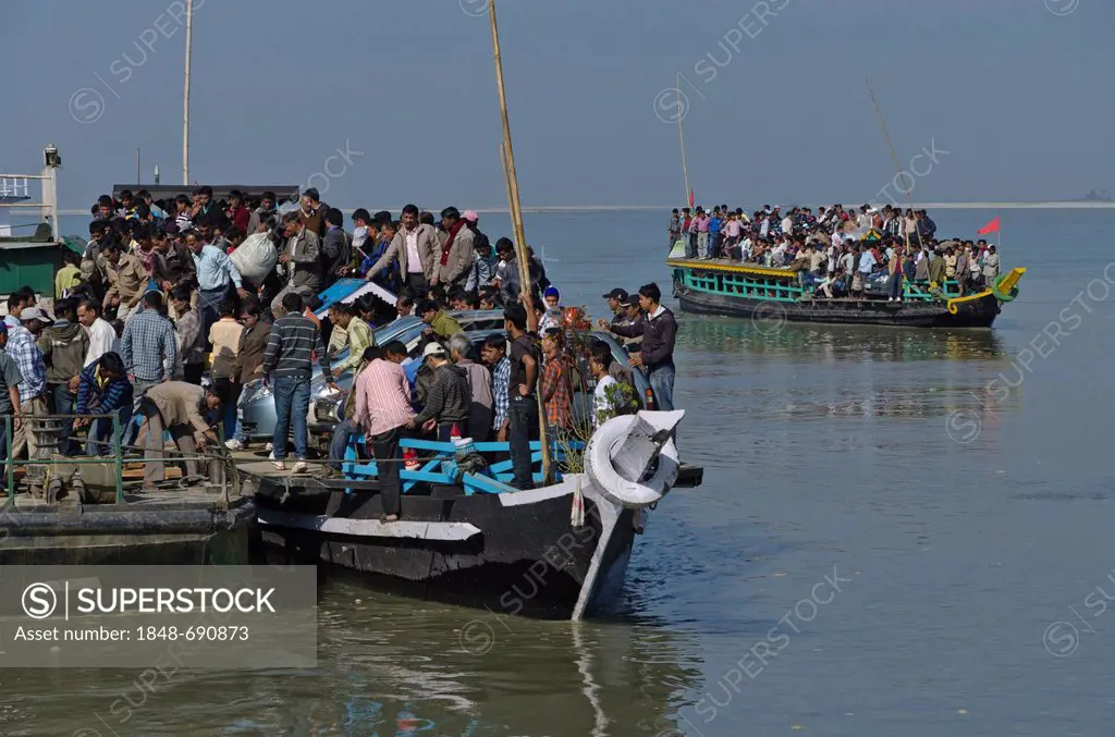 Rustic ferry-boats at Jorhat take more than one hour to cross the mighty Brahmaputra River, India, Asia